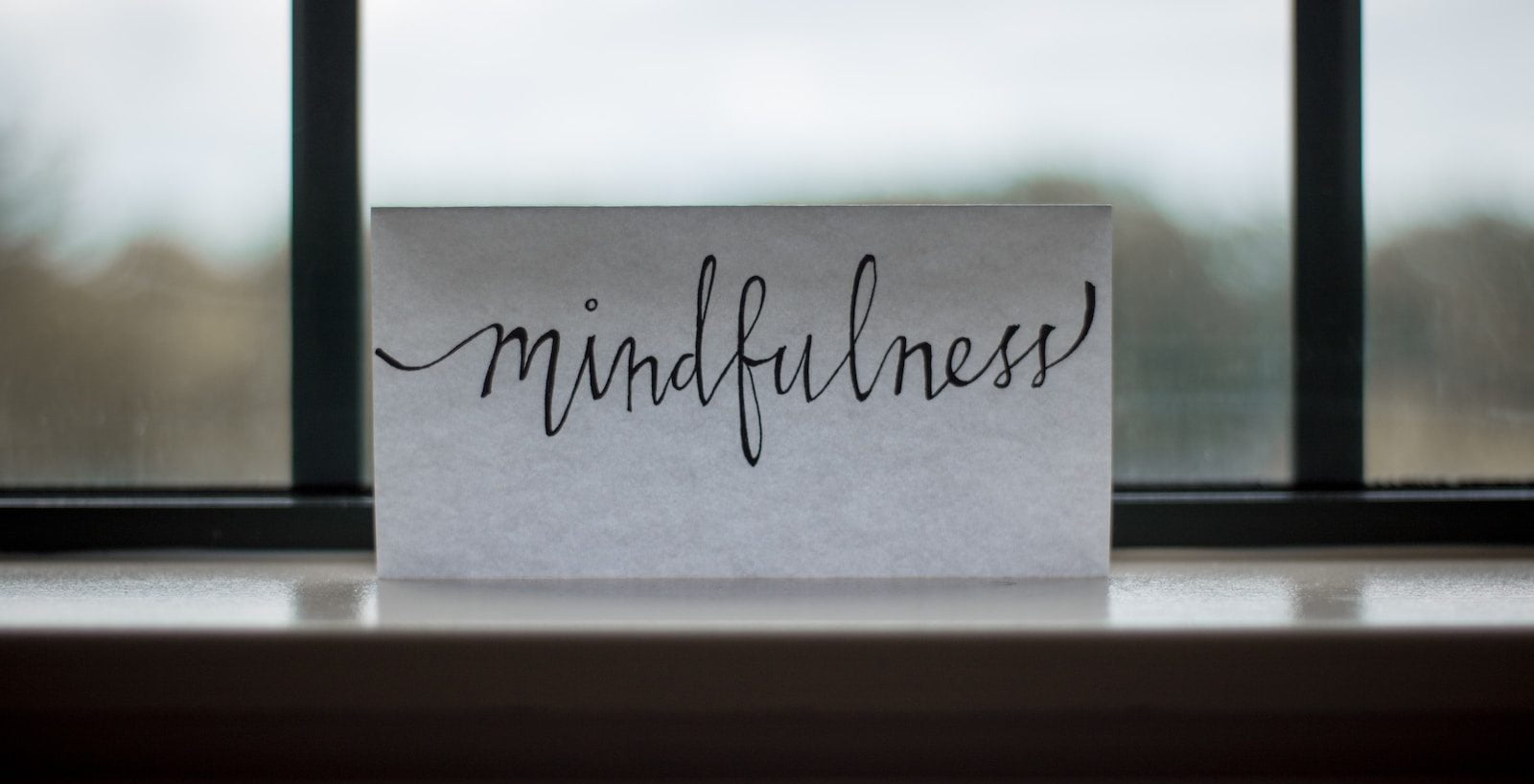 mindfulness printed paper near window